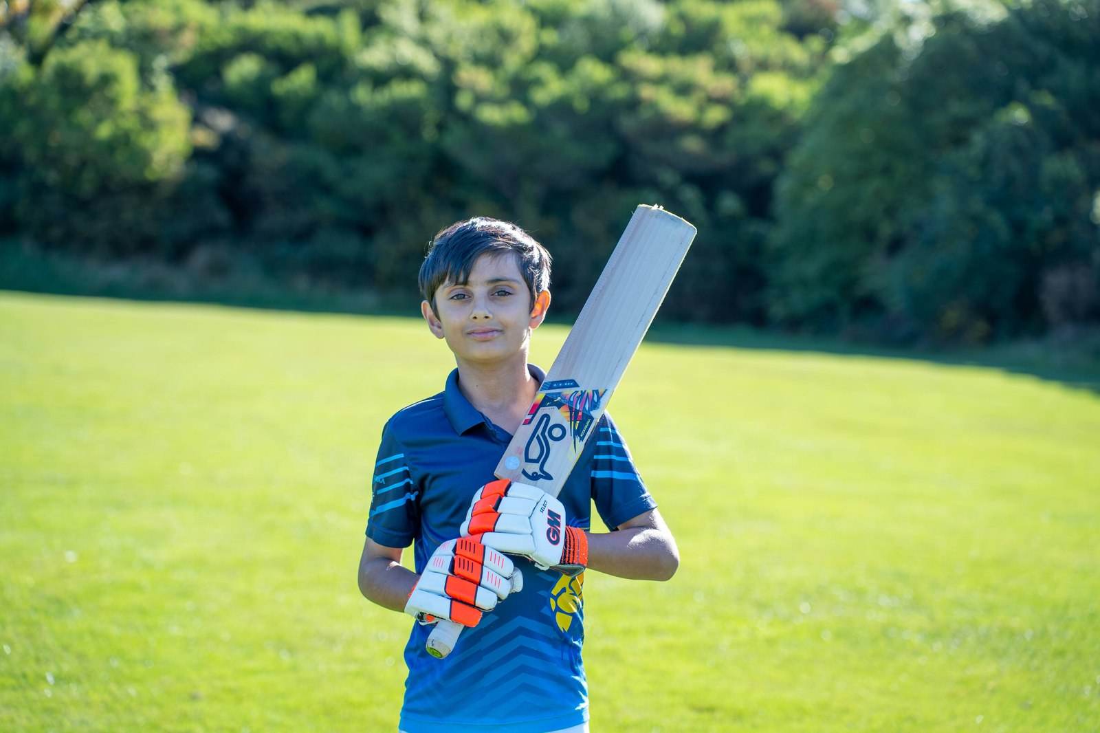 Junior Lions Cricket Club player with bat